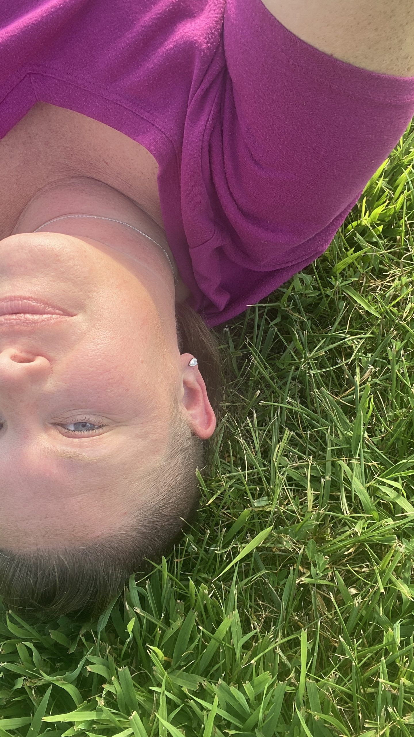 Kimberly laying on the grass with an arial shot