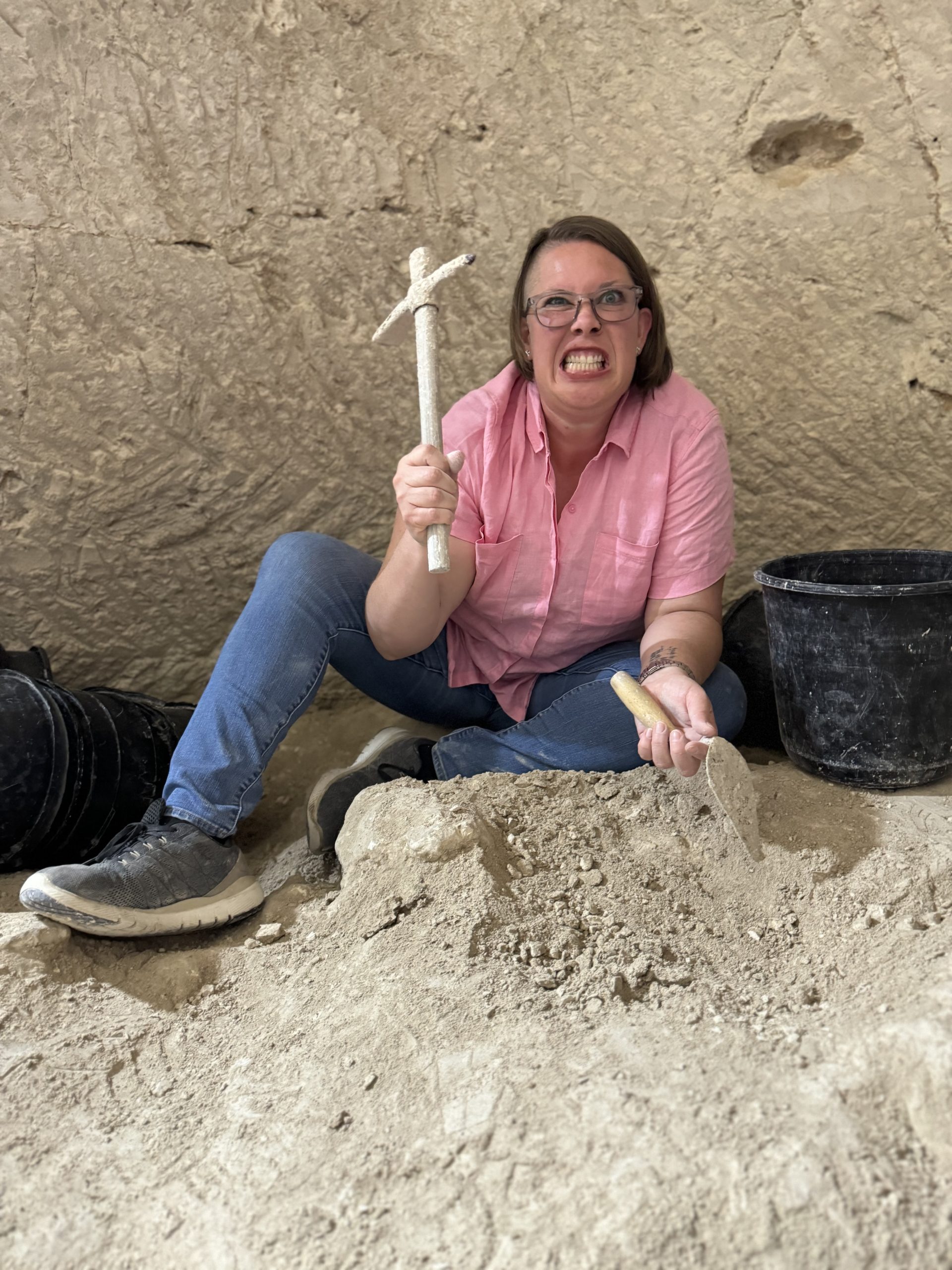 Kimberly on an archaeological dig being silly